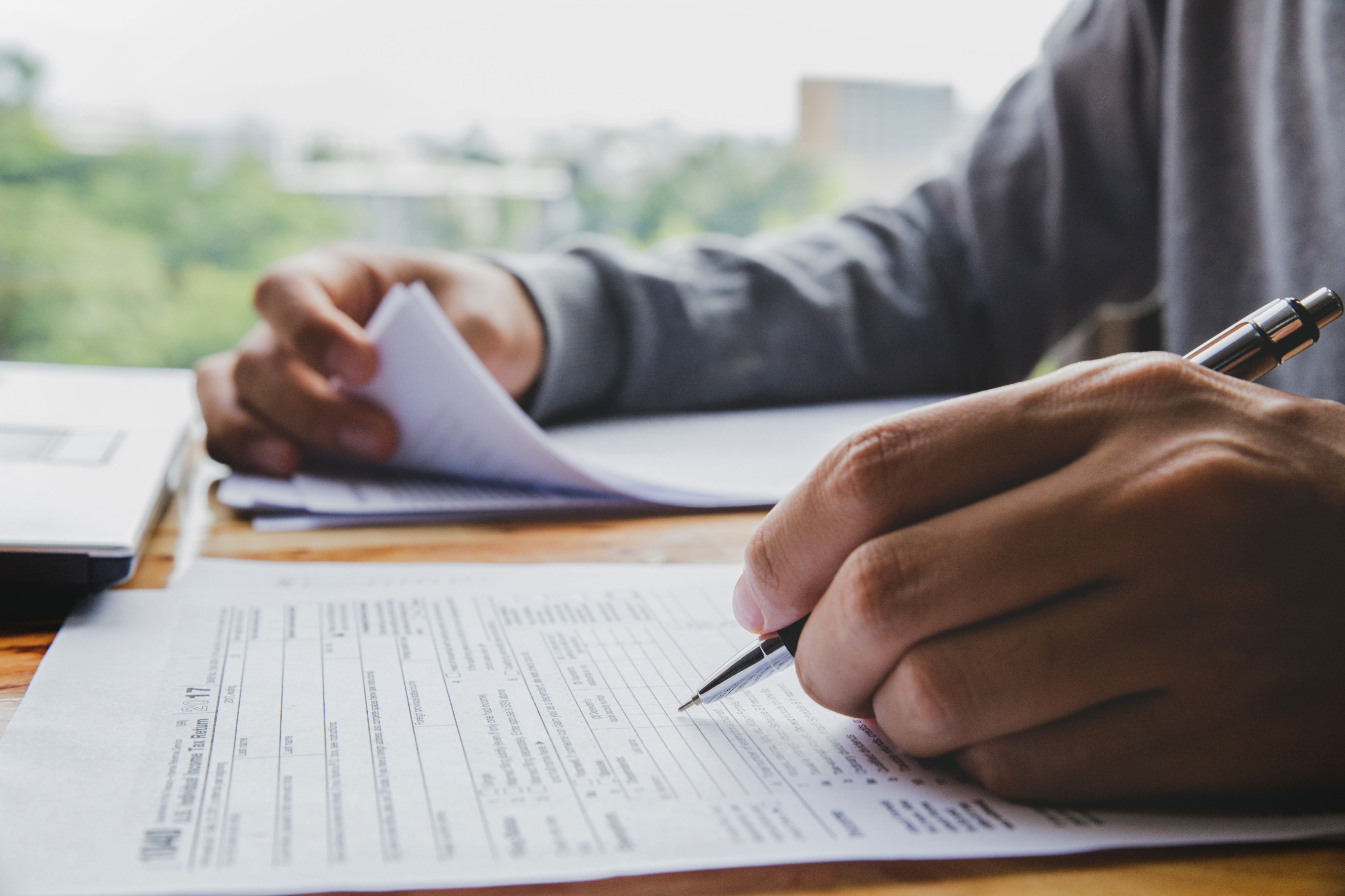 Office worker with pen on paper